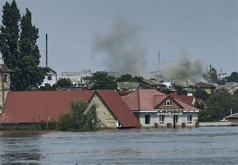 A dam collapses and thousands face the deluge — often with no help — in Russian-occupied Ukraine